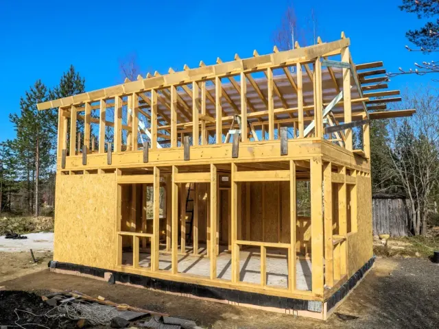 Two-storey timber-frame addition framed and sheathed on site