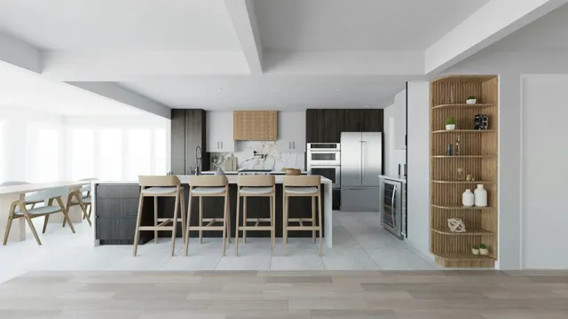 Open kitchen and dining area with a long island and bar stools, dark and white cabinetry and oak shelving